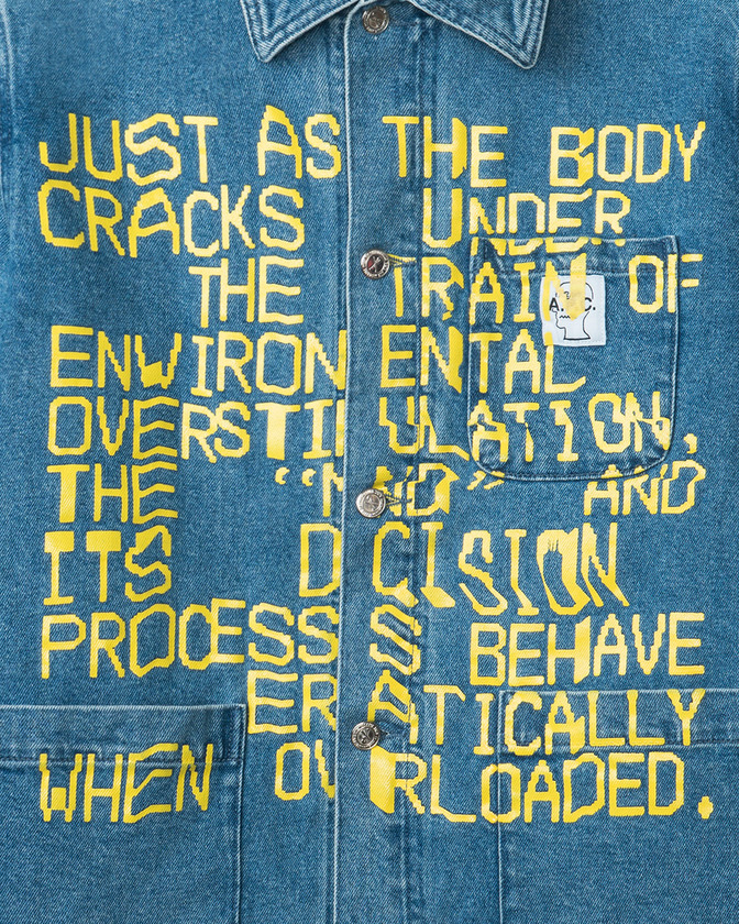 denim shirt with saying in yellow type